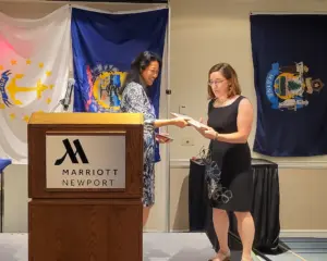 A woman receiving an award.