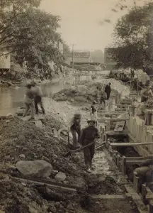 A historical photo showing workers digging the Fitchburg's sewer system in 1890.
